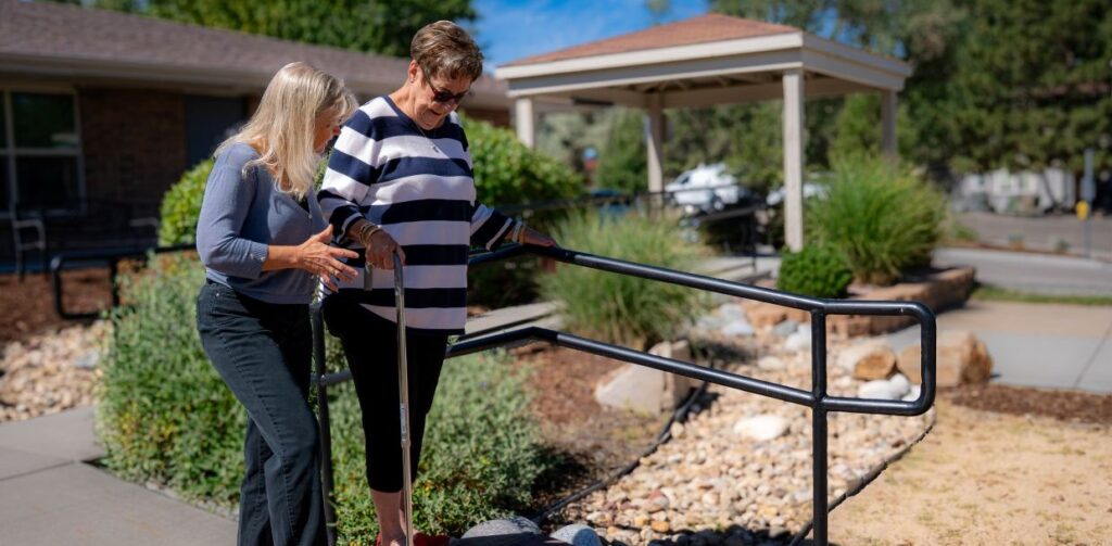 Patient being led over an uneven bridge during physical therapy.